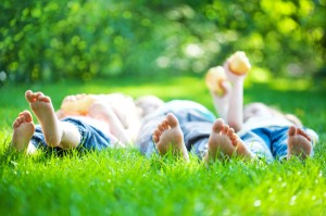Grassy lawn with feet in the air